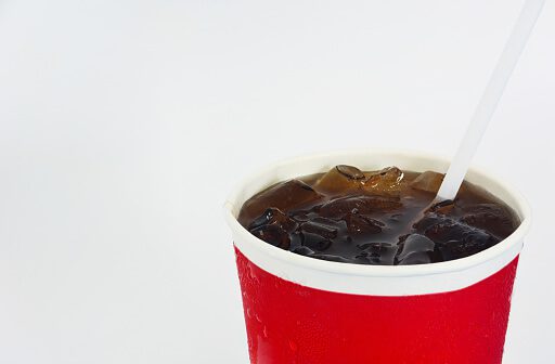 cup of cola isolated on white background, copy space