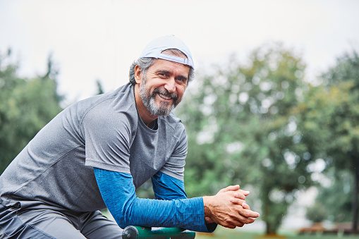 portrait of a senior man exercising and running outdoors