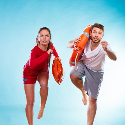 lifeguards-running-with-equipment-picture-id469077578