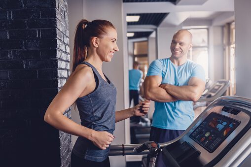 personal-training-with-a-trainer-on-a-treadmill-picture-id1079944684