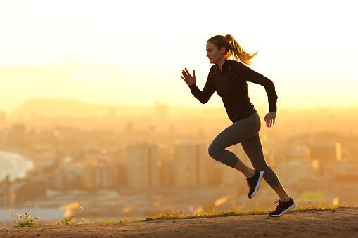 runner-woman-running-in-the-outskirts-of-the-city-picture-id1217027487