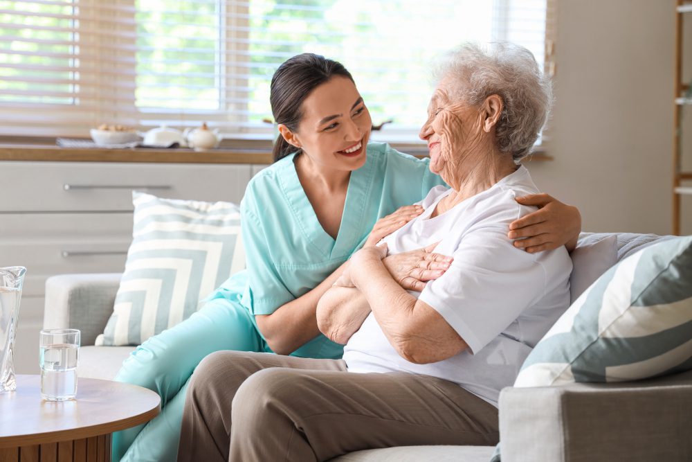 physical-therapist-hugging-senior-patient